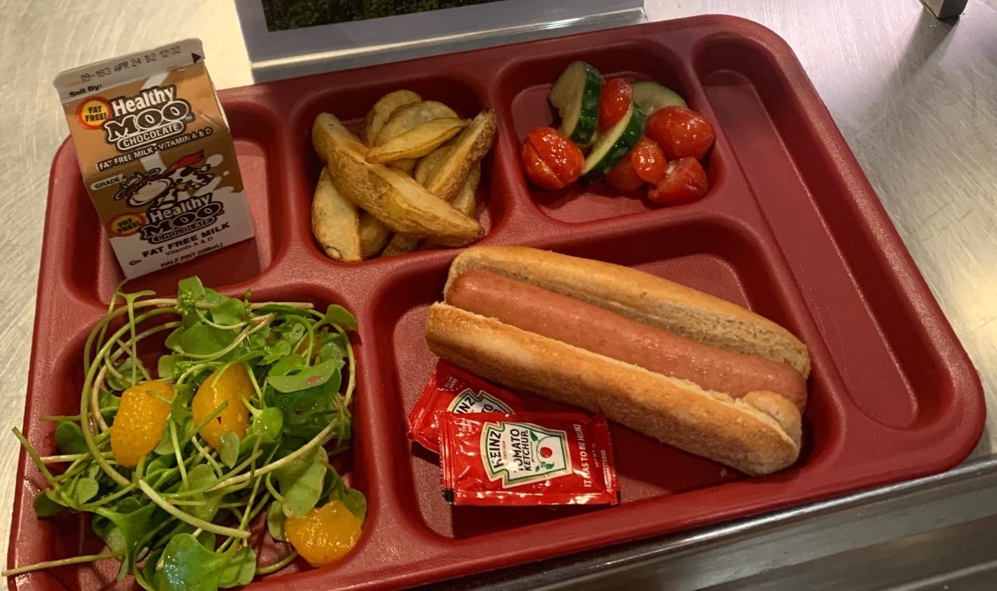 A cafeteria meal featuring seasonal vegetables
